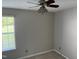 Cozy bedroom with a ceiling fan and natural light from the window at 409 Vista Springs Cir, Holly Springs, NC 27540
