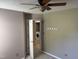 Bedroom with ceiling fan, laundry access and neutral carpet at 409 Vista Springs Cir, Holly Springs, NC 27540