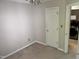 Bedroom featuring a ceiling fan, and access to an adjacent laundry area at 409 Vista Springs Cir, Holly Springs, NC 27540