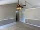 Bright living room with fan and neutral color scheme for versatile decorating at 409 Vista Springs Cir, Holly Springs, NC 27540