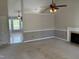 Spacious living room features carpet, a fireplace, and access to another room at 409 Vista Springs Cir, Holly Springs, NC 27540