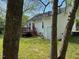 Another view of the rear exterior featuring the wooden deck and access door at 409 Vista Springs Cir, Holly Springs, NC 27540