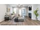 Cozy living room features a fireplace, neutral tones, ample natural light, hardwood floors and refined decor elements at 41 Goldenrod Loop, Clayton, NC 27520