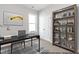 Home office offers a quiet workspace with a desk, shelving, and a window, providing a conducive environment at 41 Goldenrod Loop, Clayton, NC 27520