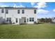 View of the home's backyard featuring a green lawn and ample space at 420 Ember St, Sanford, NC 27330