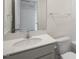 Bright bathroom featuring a white single sink vanity with a neutral color palette at 420 Ember St, Sanford, NC 27330
