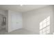 Clean bedroom with neutral carpeting, a large closet and ample natural light at 420 Ember St, Sanford, NC 27330