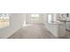 Bright, open-concept kitchen with stainless steel appliances, granite countertops, and wood-look floors at 420 Ember St, Sanford, NC 27330