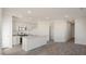 Open concept kitchen featuring stainless steel appliances, island, and shaker style cabinets at 420 Ember St, Sanford, NC 27330