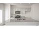 Spacious kitchen featuring an island, granite countertops, stainless steel appliances, and shaker style cabinets at 420 Ember St, Sanford, NC 27330