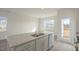 Kitchen island with granite countertops, double sink, stainless steel appliances, and dishwasher at 420 Ember St, Sanford, NC 27330