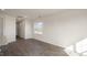 Bright living room with wood floors and a window, adjacent to kitchen at 420 Ember St, Sanford, NC 27330