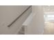 Staircase leading to a room, featuring neutral walls, and a handrail at 420 Ember St, Sanford, NC 27330