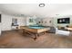 Expansive basement with classic billiards table and wet bar provides entertainment space at 4215 Cobscook Dr, Durham, NC 27707