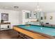 Spacious basement with a billiards table and stylish bar area for ultimate recreation at 4215 Cobscook Dr, Durham, NC 27707