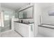 Luxury bathroom featuring a large vanity with dual sinks, a walk-in shower, and soaking tub at 4215 Cobscook Dr, Durham, NC 27707