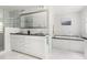 Elegant bathroom featuring a double vanity, walk-in shower, soaking tub, and modern fixtures at 4215 Cobscook Dr, Durham, NC 27707