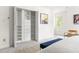 Bedroom with closet featuring ample shelving and drawer space, next to the bed at 4215 Cobscook Dr, Durham, NC 27707