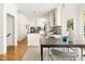 Bright kitchen features custom cabinets, stainless appliances, and an island with bar seating at 4215 Cobscook Dr, Durham, NC 27707