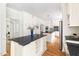 Gourmet kitchen features an island, custom cabinets, and stainless steel appliances at 4215 Cobscook Dr, Durham, NC 27707