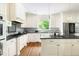 Bright and airy kitchen features an island and stainless steel appliances at 4215 Cobscook Dr, Durham, NC 27707