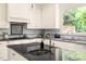 Beautiful kitchen with stainless steel appliances, granite countertops, and an island at 4215 Cobscook Dr, Durham, NC 27707