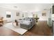 Spacious living room with hardwood floors, a wet bar, and a pool table for entertainment at 4215 Cobscook Dr, Durham, NC 27707