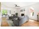 Bright living room with hardwood floors, fireplace, white trim, and comfortable seating, perfect for relaxing at 4215 Cobscook Dr, Durham, NC 27707