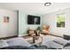 Modern living room with stylish decor, comfortable seating, and a large screen TV for entertainment at 4215 Cobscook Dr, Durham, NC 27707