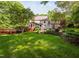 Expansive backyard featuring a deck, screened porch, and well-maintained lawn at 4405 New Brighton Dr, Apex, NC 27539