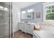 Bright bathroom features double sinks and a soaking tub at 4405 New Brighton Dr, Apex, NC 27539