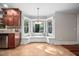 Cozy breakfast nook with a built-in bench seat, a pendant light, and natural light from large windows at 4405 New Brighton Dr, Apex, NC 27539