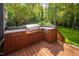 Outdoor kitchen with a stainless steel grill and wooden cabinets at 4405 New Brighton Dr, Apex, NC 27539