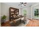 Bright office space featuring hardwood floors, desk, and bookshelves for a productive work environment at 4405 New Brighton Dr, Apex, NC 27539