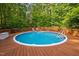 Above-ground pool with a wooden deck, offering a private backyard retreat at 4405 New Brighton Dr, Apex, NC 27539