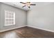 Bedroom with hardwood floors, neutral walls, and ceiling fan at 494 Mulberry Banks Dr, Clayton, NC 27527