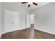 Bedroom with hardwood floors, double door closet, and natural lighting at 494 Mulberry Banks Dr, Clayton, NC 27527