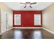 Spacious bedroom with wood floors, ceiling fan, and two windows providing lots of natural light at 494 Mulberry Banks Dr, Clayton, NC 27527