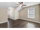 A bedroom featuring a ceiling fan, a window, and hardwood floors at 494 Mulberry Banks Dr, Clayton, NC 27527