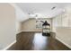Spacious bonus room with hardwood floors, natural lighting and a treadmill at 494 Mulberry Banks Dr, Clayton, NC 27527