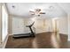 Spacious bonus room featuring hardwood floors and a treadmill at 494 Mulberry Banks Dr, Clayton, NC 27527