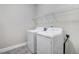 Laundry room features a washer, dryer, and a wire rack at 494 Mulberry Banks Dr, Clayton, NC 27527