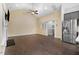 Open concept living room features wood floors, tall ceilings, fireplace, and access to kitchen at 494 Mulberry Banks Dr, Clayton, NC 27527
