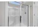 Modern glass-enclosed shower with chrome fixtures and a built-in bench at 494 Mulberry Banks Dr, Clayton, NC 27527