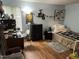 Comfortable bedroom with hardwood floors, a dresser, desk, and natural light from the window at 500 Umstead # 208D, Chapel Hill, NC 27516
