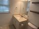 Bathroom with a stone countertop, vanity, and view from the window at 5026 Gatewood Drive Dr, Durham, NC 27712