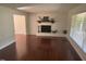 Bright living room with hardwood floors and a fireplace, creating a warm and inviting atmosphere at 5026 Gatewood Drive Dr, Durham, NC 27712
