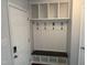 Convenient mud room with built-in storage, bench, and coat hooks, providing functionality at 5026 Gatewood Drive Dr, Durham, NC 27712