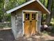 Outdoor storage shed with double doors and rustic accents at 5026 Gatewood Drive Dr, Durham, NC 27712
