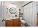 Bathroom featuring a wood vanity, updated fixtures, and a shower with a white shower curtain at 53 Forest Oaks Dr, Durham, NC 27705